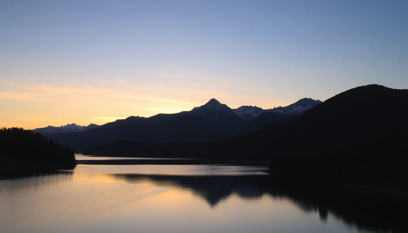 Serene Sunset Over Mountain Lake